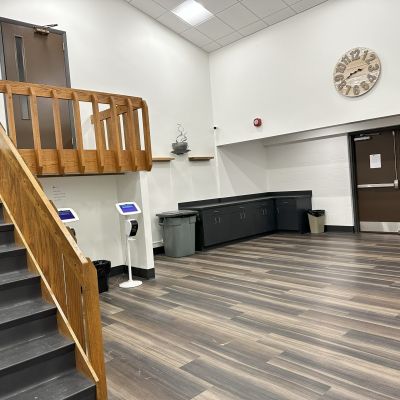 A coffee bar and a set of stairs leading to the former sanctuary of the Westwood Alliance Church
