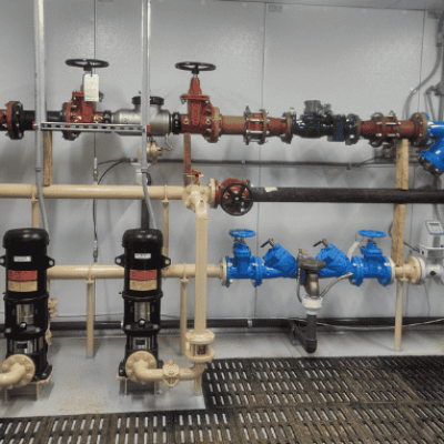 Booster station piping at Pleasant Hill Lake Park supporting adequate water pressure for the force main installed beneath Pleasant Hill Lake