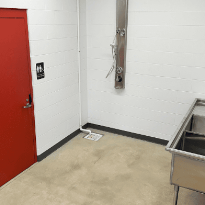 A decontamination station at the Plymouth Fire Station includes an accessible shower and utility sink.