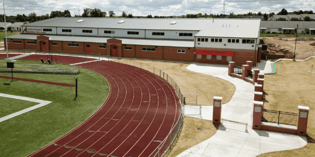 The fieldhouse at Ashland City Schools is situated just south of the 8-lane track at the high school football stadium. A concrete walkway connects the fieldhouse to the stadium entrance.