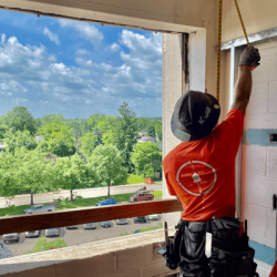 A Simonson Construction employee uses a tape measure during a dormitory interior renovation at Ashland University.