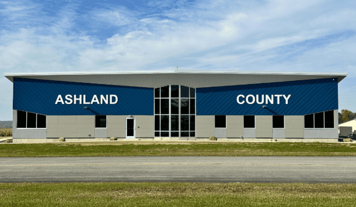 The East entrance of the new airport terminal building features large white lettering that spells out "Ashland County."