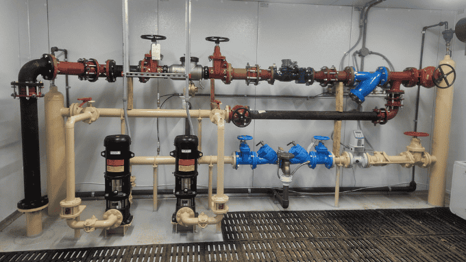 Booster station piping at Pleasant Hill Lake Park supporting adequate water pressure for the force main installed beneath Pleasant Hill Lake