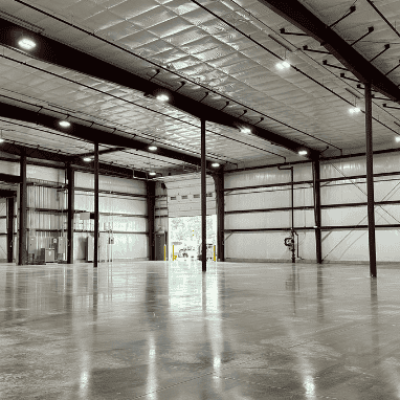 An interior view of a pre-engineered metal building that serves as a metal fabrication facility.