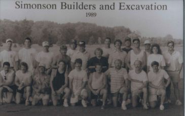 All employees of Simonson Builders and Simonson Excavation are posed in a black and white photo taken in 1989.