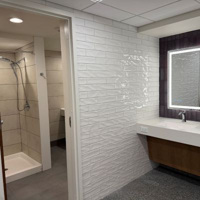 Private restrooms include a shower and toilet on several floors of Ashland University Amstutz Hall. Each 6-restroom pod includes a double sink with vanity mirrors.